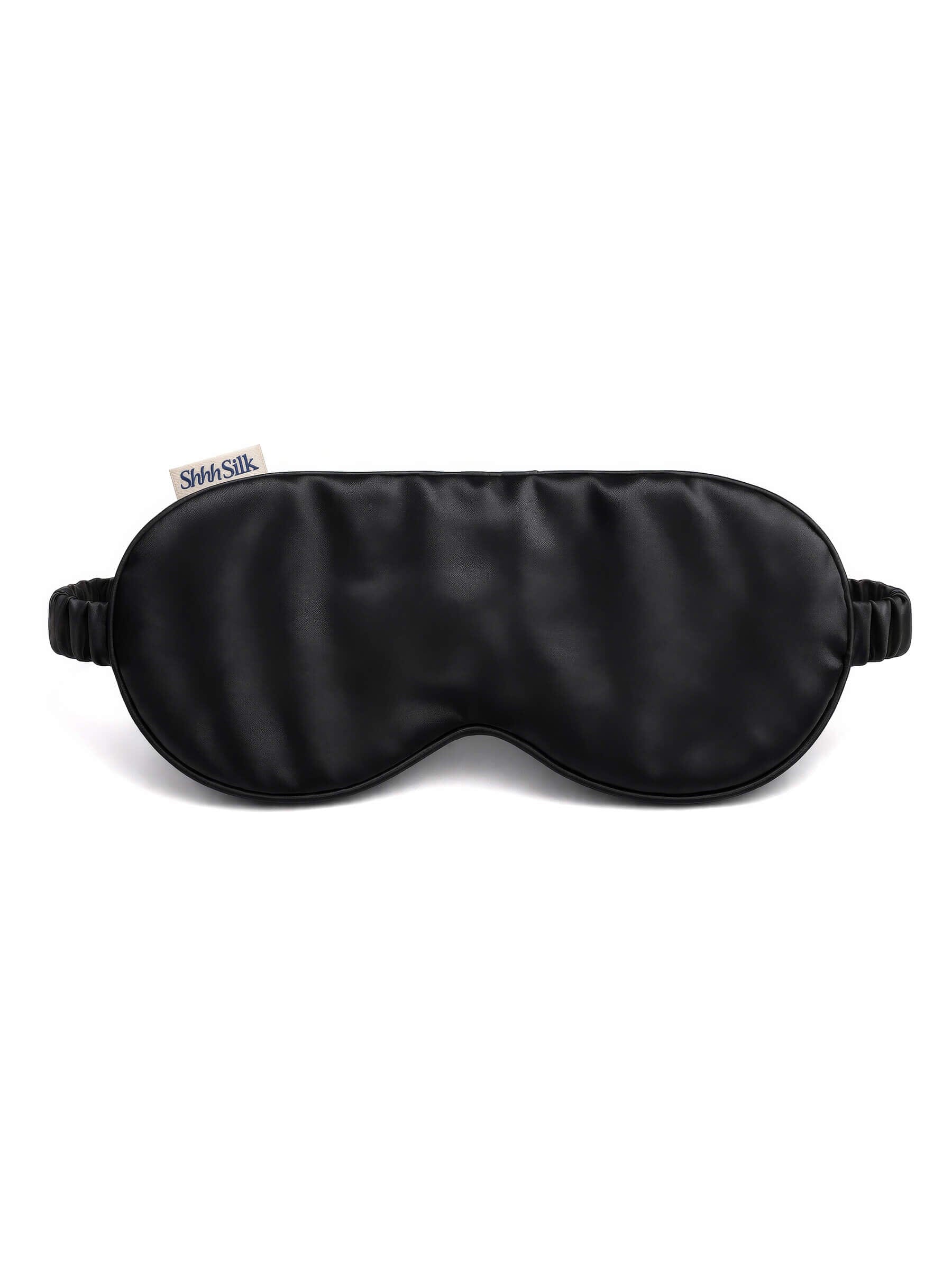 Black silk sleep mask with a brand logo on a white background