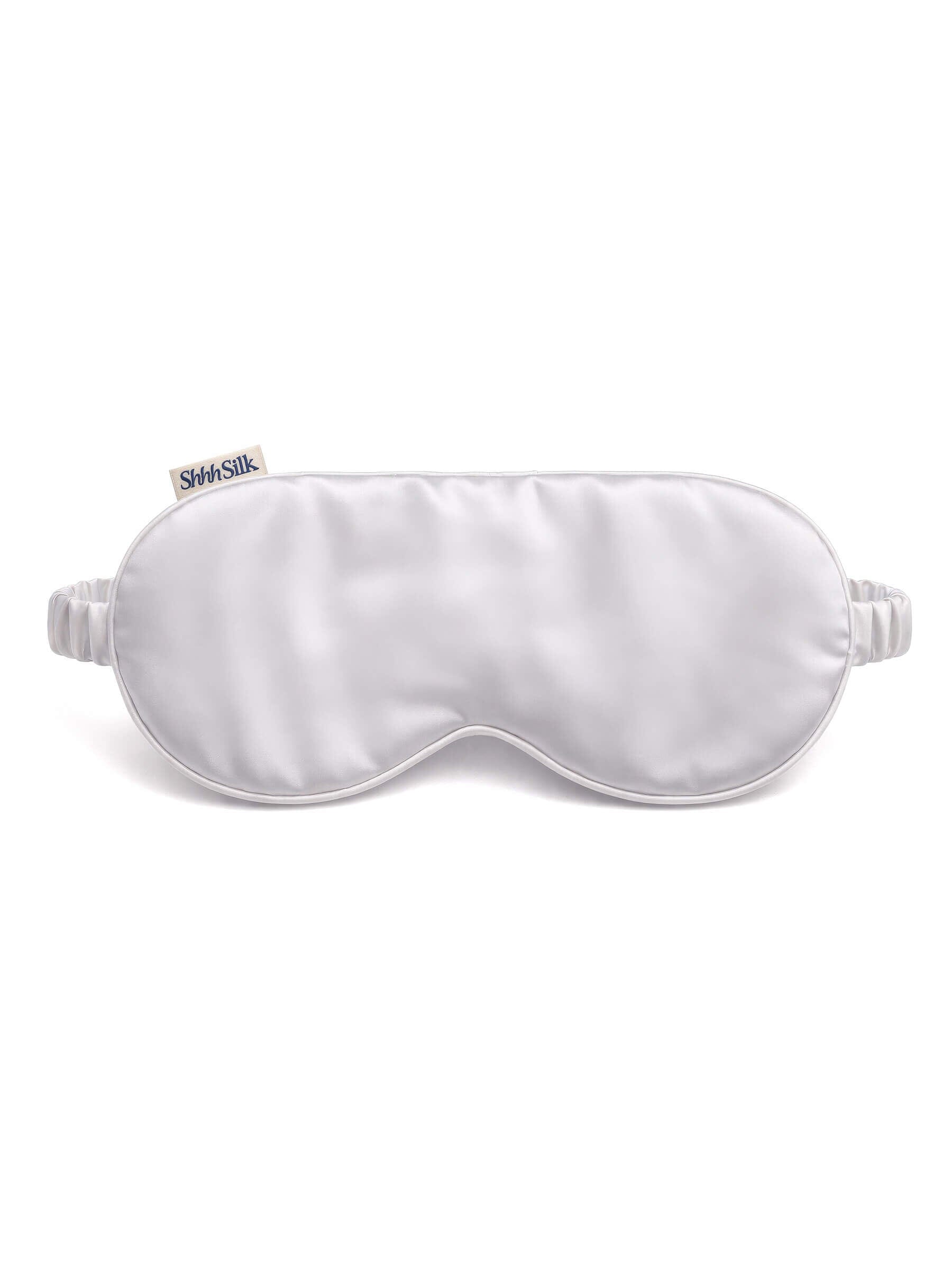 Grey silk sleep mask on a white background