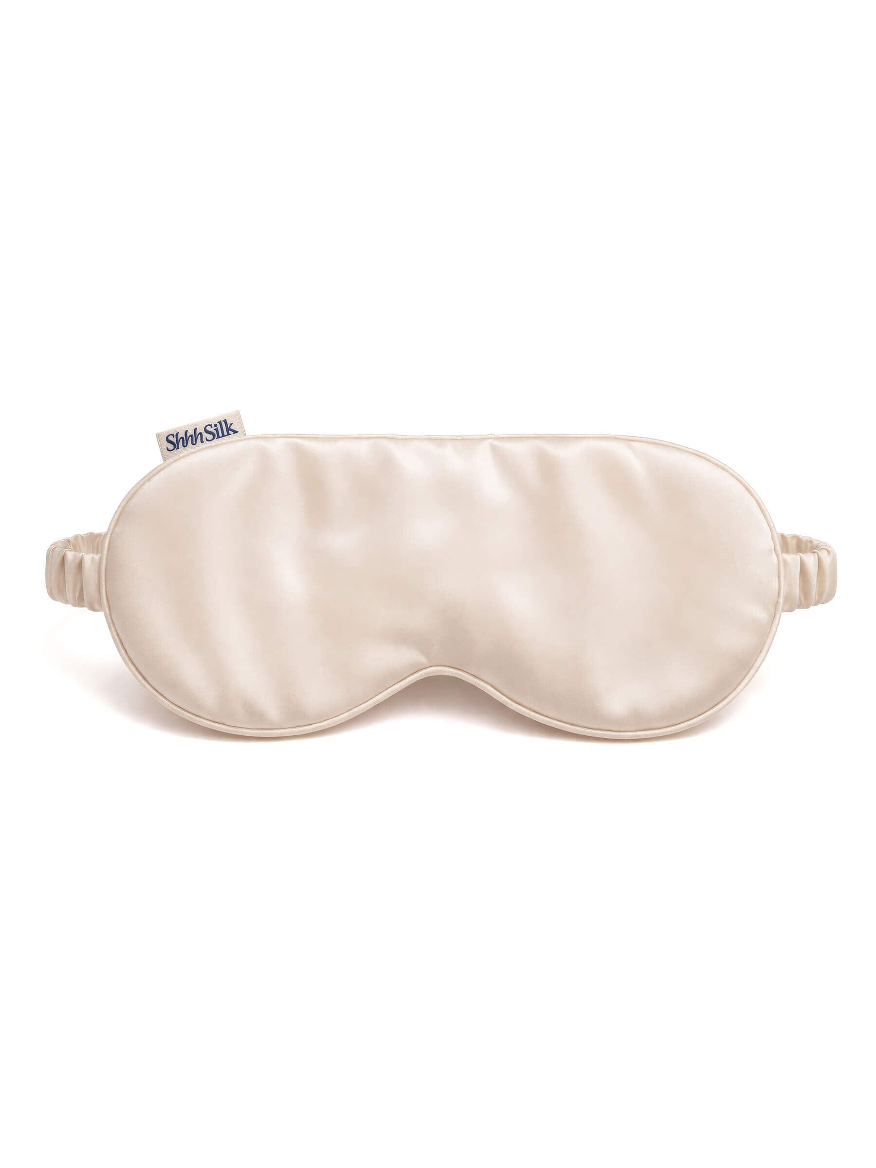 Nude silk sleep mask on a white background
