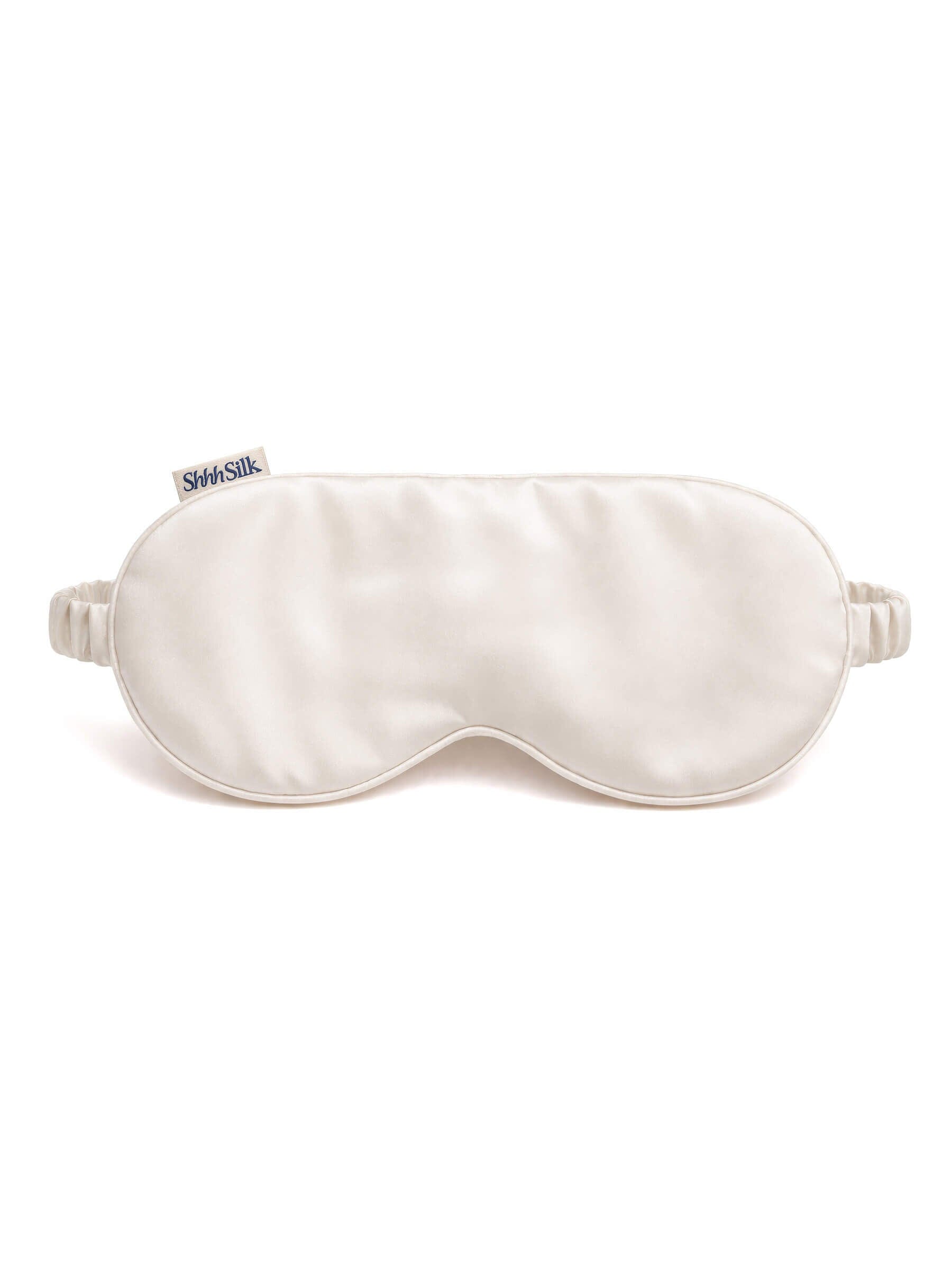 White silk sleep mask on a white background