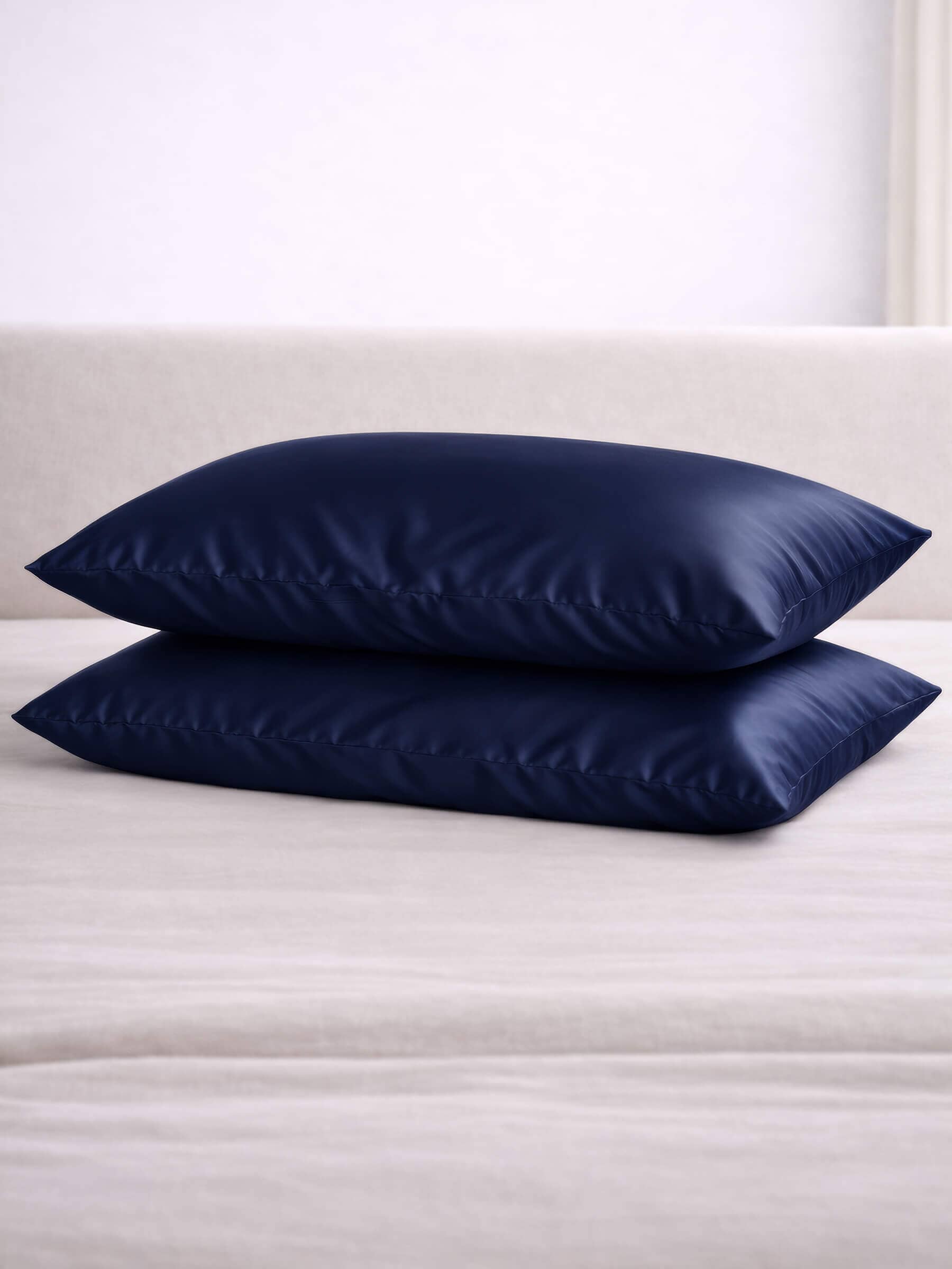 2 mulberry queen size navy silk pillowcases stacked on top of each other