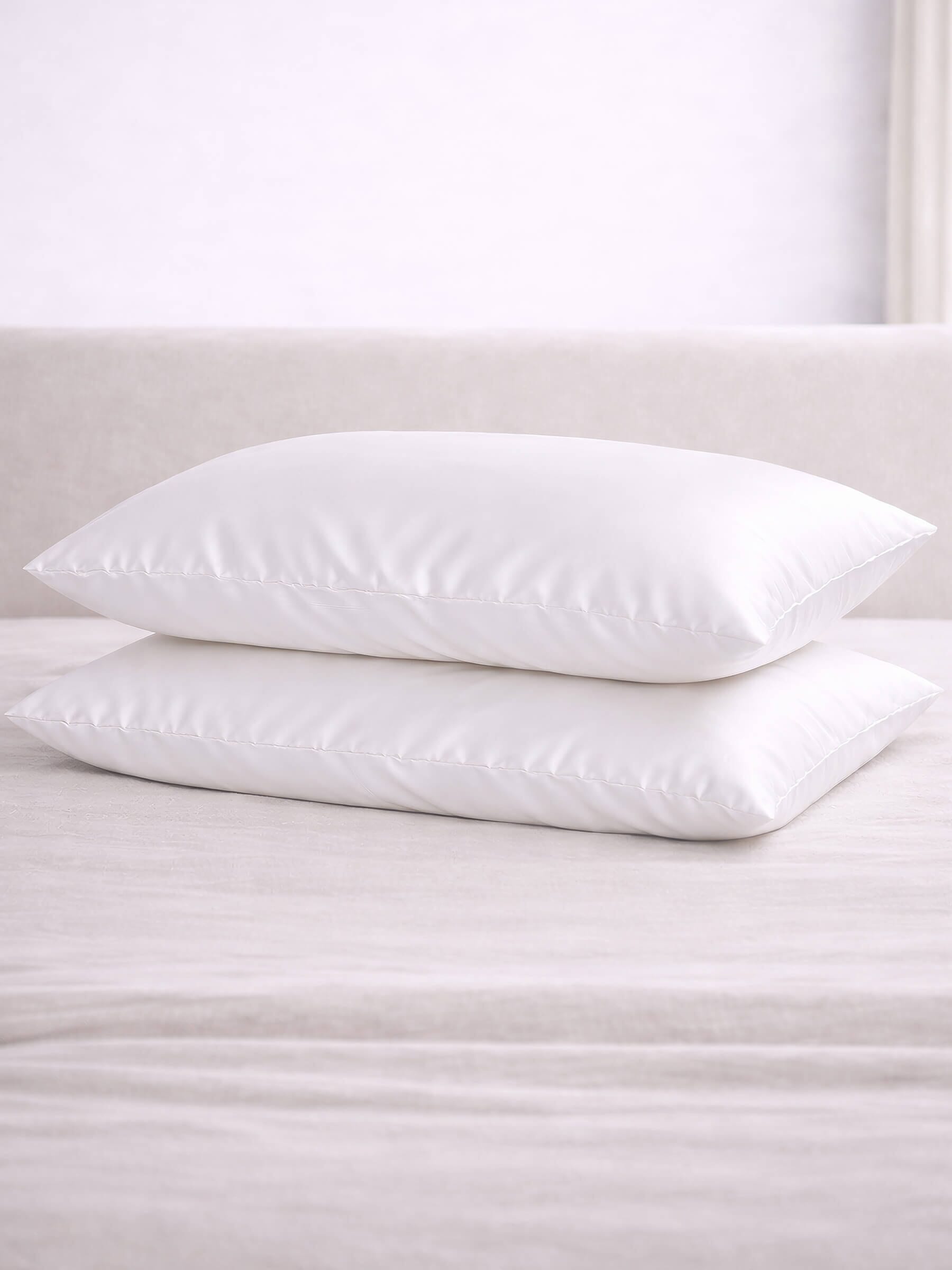 2 mulberry queen size pure white silk pillowcases stacked on top of each other