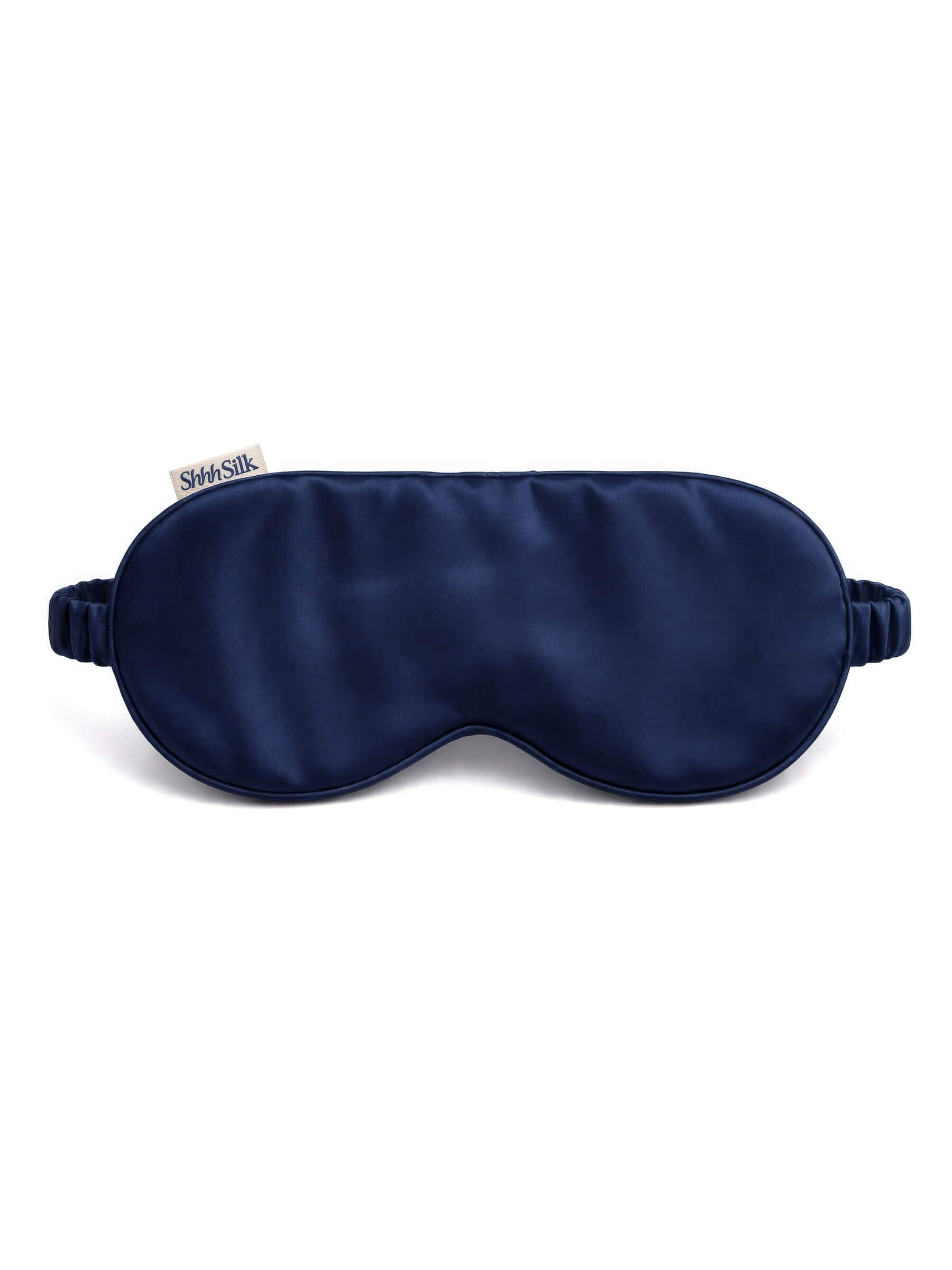 Navy silk sleep mask on a white background